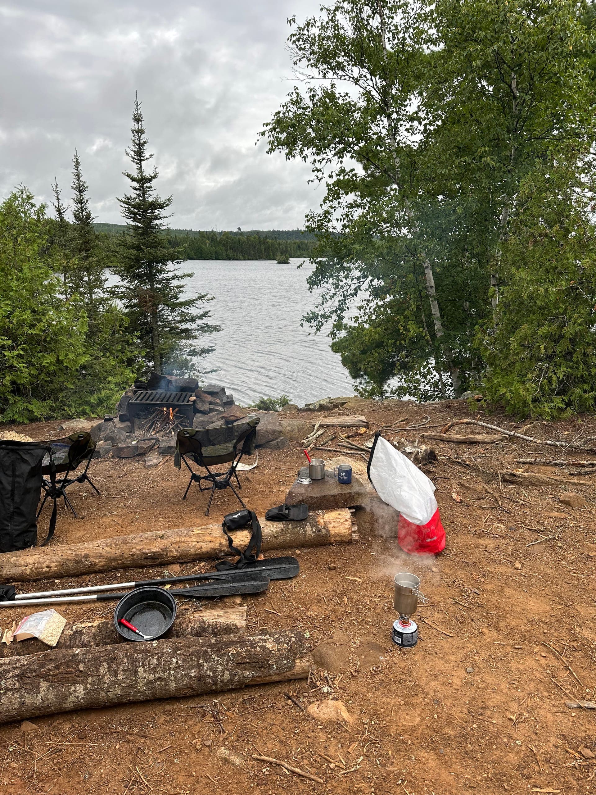 A BWCA campsite with a tent pitched among the pines